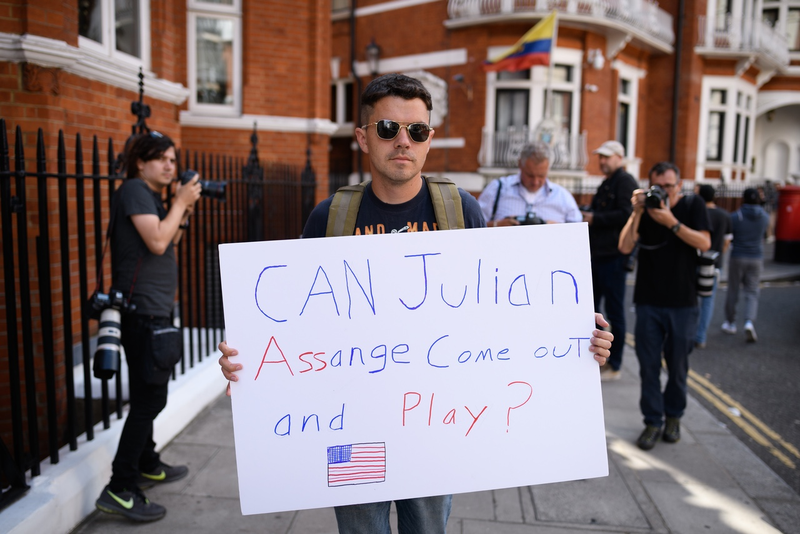 An American man protests against the actions of Wikileaks and Julian Assange outside the Ecuadorian embassy on July 30, 2018 in London, England